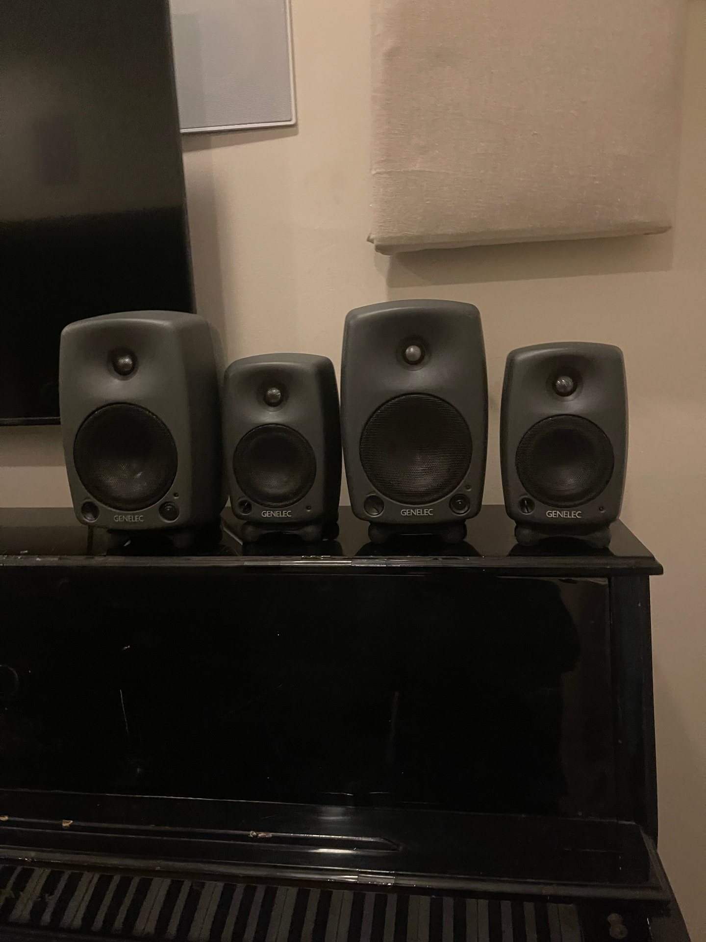 Plate 01 — Four Genelec near-fields on the upright